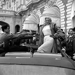 Screen Prints: Actress Diana Dors surrounded by autograph hunters at Cannes Film Festival May