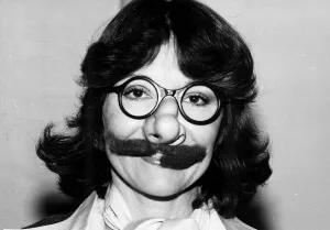 Occupation A Prints: Actress Diana Rigg wearing false moustache and glasses December1980 A©mirrorpix