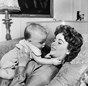 Actress Elizabeth Taylor at home with her baby son Michael. September 1953 D5729