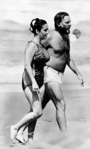 Actress Elizabeth Taylor and husband Richard Burton on the beach