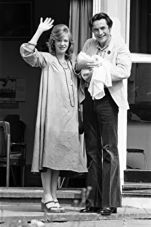 Actress Hayley Mills and actor Leigh Lawson proudly show off their love child for