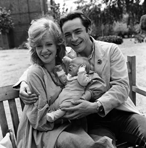 Actress Hayley Mills and actor Leigh Lawson proudly show off their love child for
