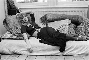 Actress Helen Mirren pictured lying down on her sofa at her Fulham home September