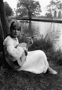Actress Helen Mirrren barefooted in her normal maxi everyday dress practising on the bank