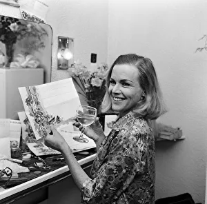 00881 Prints: Actress Honor Blackman reads telegrams of congratulations in her dressing room
