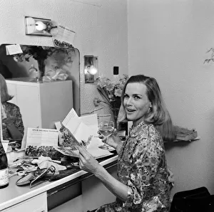 00881 Prints: Actress Honor Blackman reads telegrams of congratulations in her dressing room