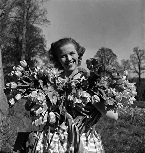 Spring Prints: Actress Honor Blackman seen here with flowers in the gardens of Pinewood studio