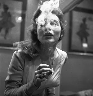 Square Prints: Actress Janet Leigh gets her nicotine fix at a costume fitting for the film The Vikings
