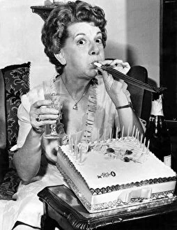 00785 Collection: Actress Jean Alexander gets the party spirit-with champagne, cake and key of the door