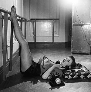 00140 Collection: Actress Jean Marsh aged 17 posing witha telephone April 1952