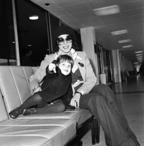 Arrival Prints: Actress Joan Collins and her 2 year old daughter Katyania leaving Heathrow airport for