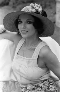 01081 Prints: Actress Joan Collins modelling outfits that she will wear on a trip to Tokyo to judge a