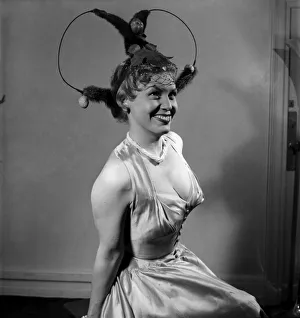 00012 Prints: Actress Joan Morgan who is starring in Cabaret in the West End seen here modelling hat