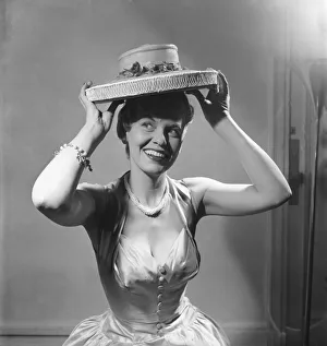 Actress Joan Morgan who is starring in Cabaret in the West End seen here modelling hats