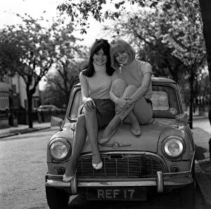 Actress Judy & Sally Geeson outside their home 1967 sitting on Mini motorcar