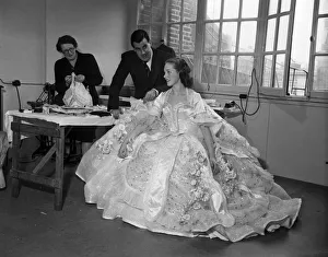 01044 Prints: Actress Julie Andrews trying on a dress for her role in the pantomime Cinderella