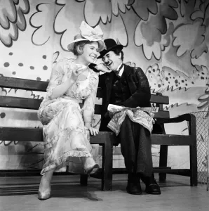 Actress Juliet Mills with her father, actor John Mills who is dressed as Charlie Chaplin