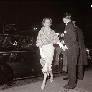 Square Prints: Actress Lauren Bacall is helped out of her car as she arrives at the royal film show