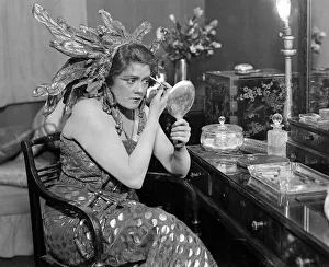 Actress Lily Brayton seen here in her dressing room making up for the role of Chu Chu
