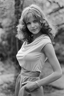 Actress Madeline Smith poses outdoors wearing sleeveless top. 12th September 1976