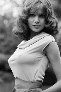 Actress Madeline Smith poses outdoors wearing sleeveless top. 12th September 1976