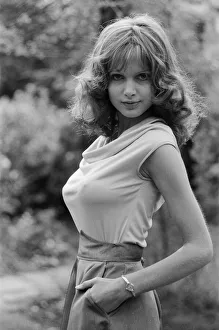 Actress Madeline Smith poses outdoors wearing sleeveless top. 12th September 1976