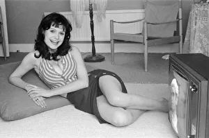 Actress Madeline Smith watching television at her flat in Kew. 6th September 1974