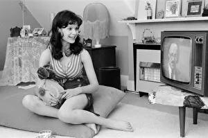 Actress Madeline Smith watching television at her flat in Kew. 6th September 1974