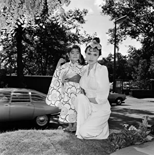 Actress Madeline Smith with three year old Kana Chiba from Japan at the Summer party of