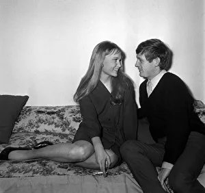 Square Prints: Actress Mia Farrow with singer John Leyton April 1964 sitting on sofa talking