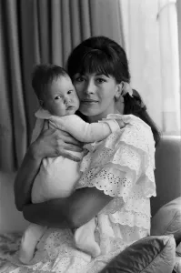 Actress Nanette Newman with her 4 month old daughter Emma at their home in Virginia Water
