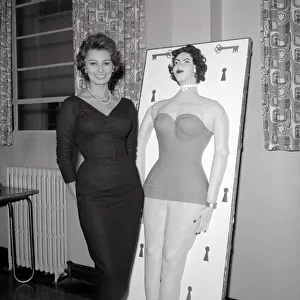 Core54 Prints: Actress Sophie Loren seen here standing beside a life size cake of her self Circa