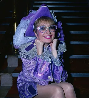 Actress Sue Pollard December 1985 wearing lilac outfit and hat