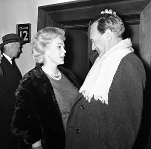 Actress Zsa Zsa Gabor & actor Trevor Howard greet one another on arrival at London