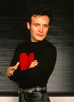 Arms Folded Prints: Adam Ant pop singer January 1990 Arms folded black jumper red heart - Stuart