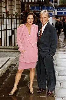 Adam Faith actor with actress Zoe Wanamaker outside the Park Lane Hotel