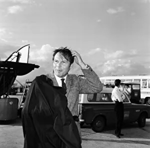 01057 Prints: Adam West, who plays Batman on TV, pictured on arrival at Heathrow Airport. 7th May 1967