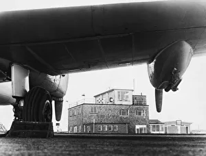 Swansea Prints: The administrative buildings at Swansea airport seen here framed in the engine of one of