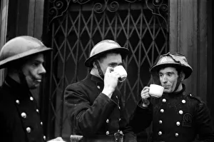 AFS Firemen having a tea break during a daylight raid on 31st January 1941