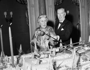 Jon Scan Prints: Agatha Christie cuts cake with sword 1962 at 10th anniversary of the play Mousetrap