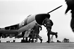 Air crew of 617 Squadron scramble their Avro Vulcan Bomber at RAF Scampton as part of a