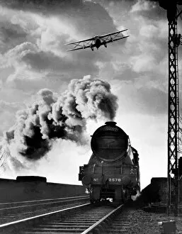 Images Dated 2nd October 2012: An Air Express, the Imperial Airways latest machine, flying over another express -