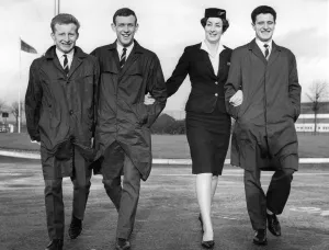 Air Hostess at Renfrew Airport escorts Celtic players Johnstone, Lennox & Gallagher