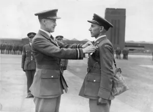 Air Office Commander JT Babington presenting The Air Force Medal (AFM