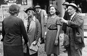 01437 Prints: Air Raid Victims of the Blitz, London. The girl being led away is Miss J W Stokes