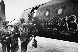 Airborne troops of 6th Airlanding infantry Brigade admire the graffiti chalked
