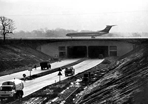 Motorways Prints: An airliner on Manchester Airports new main runway extension which bridges