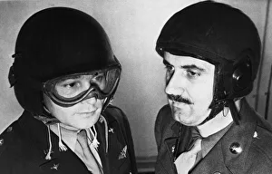 US Airmen model new protective helmets during Second World War. Circa 1944