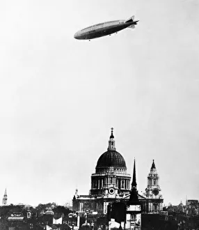 Cathedral Prints: The airship R101 seen here flying over St Pauls Cathedral on her first proving flight