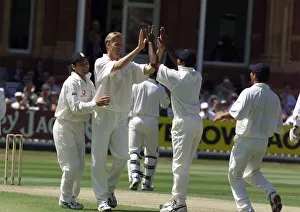 Alan Mullally celebrates with Mark Ramprakesh July 1999 (left
